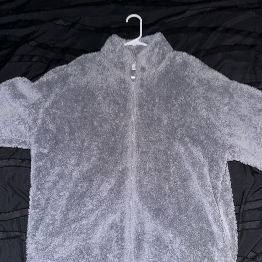 It is a fluffy jacket from Victoria’s Secret in a size large